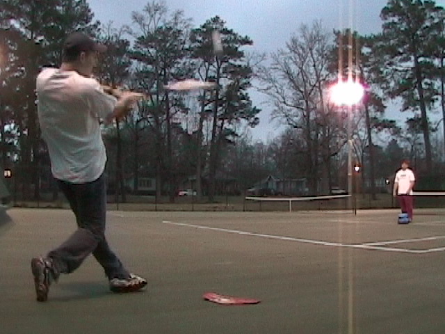 Jeff playing on a tennis court